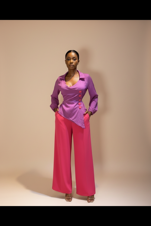 Mannequin wearing a pink and purple outfit with decorative elements on a neutral background